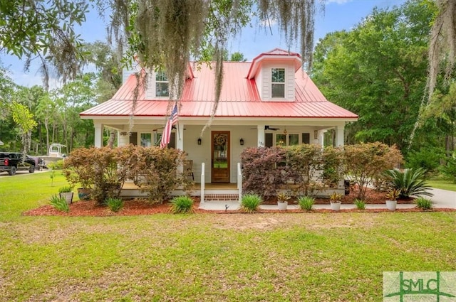 186 Goodman Dr, Midway, GA 31320 - view of front facade featuring a porch, ceiling fan, a front yard, and metal roof