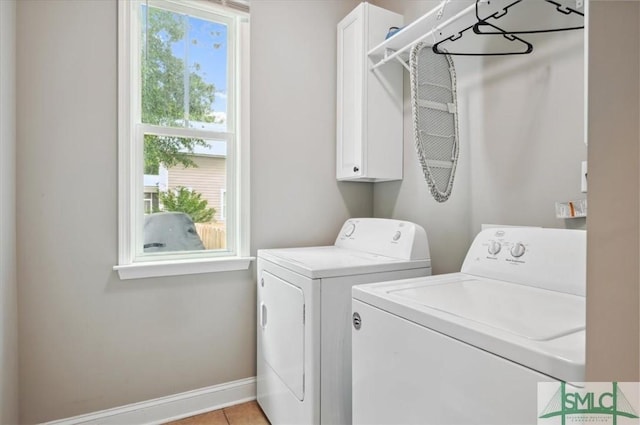 186 Goodman Dr, Midway, GA 31320 - laundry room with cabinet space, separate washer and dryer, baseboards, and light tile patterned flooring