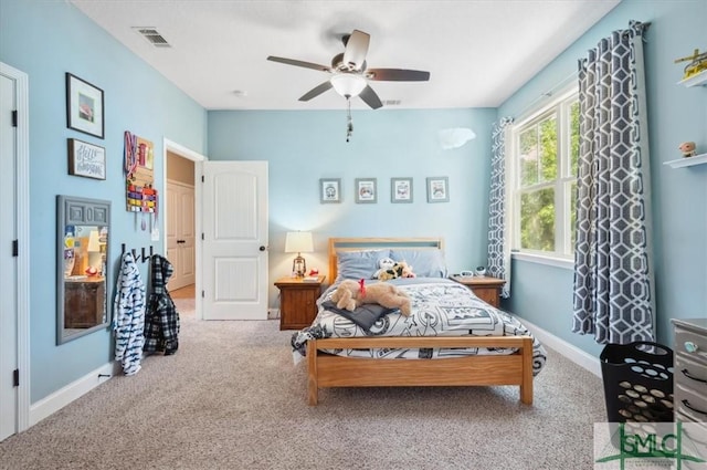 186 Goodman Dr, Midway, GA 31320 - bedroom with carpet floors, baseboards, and a ceiling fan