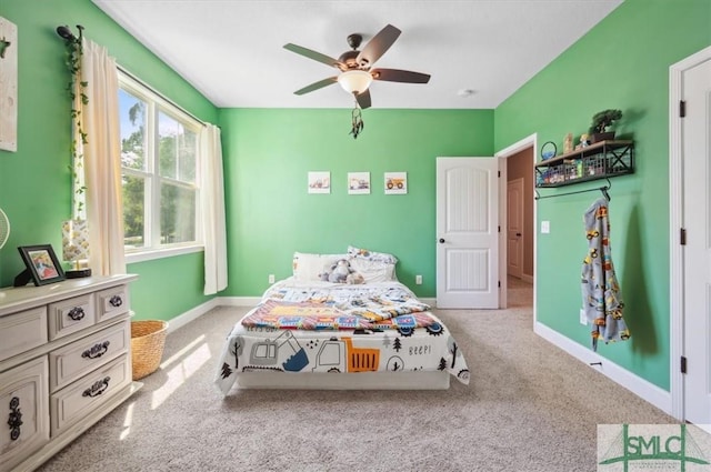 186 Goodman Dr, Midway, GA 31320 - carpeted bedroom with a ceiling fan and baseboards