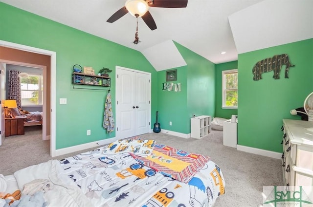 186 Goodman Dr, Midway, GA 31320 - carpeted bedroom featuring a closet, baseboards, lofted ceiling, and a ceiling fan