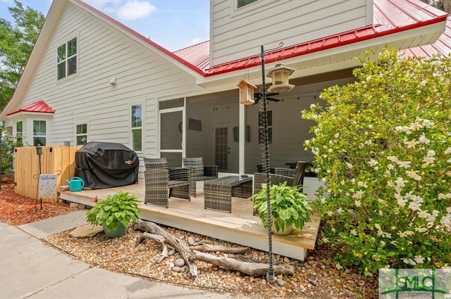 186 Goodman Dr, Midway, GA 31320 - rear view of house with a deck and metal roof