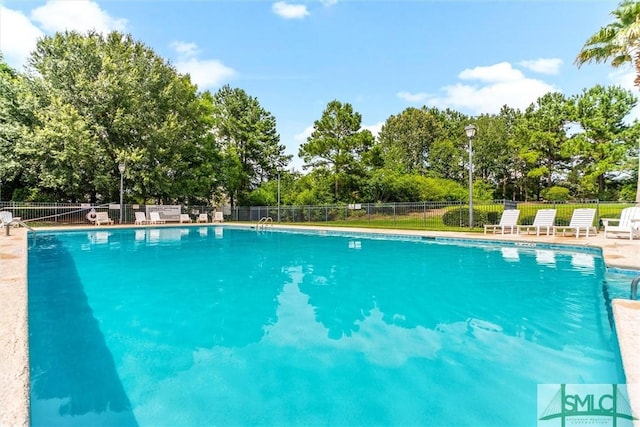 81 Parker Ln, Richmond Hill, GA 31324 - community pool with fence and view of wooded area