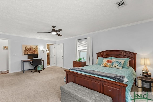 bedroom with crown molding, baseboards, an office area, a textured ceiling, and light colored carpet
