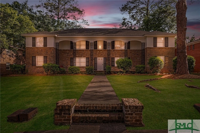 21 Berkley Pl, Savannah, GA 31405 - view of front of home with brick siding and a lawn
