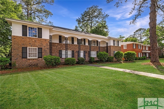 21 Berkley Pl, Savannah, GA 31405 - view of front of house with brick siding and a front lawn