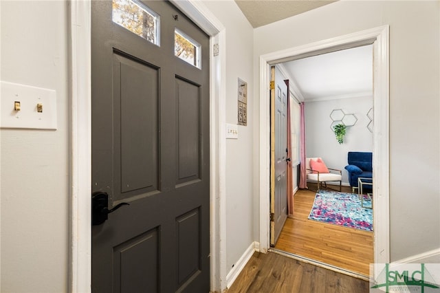 21 Berkley Pl, Savannah, GA 31405 - foyer entrance with dark wood-style floors, baseboards, and ornamental molding