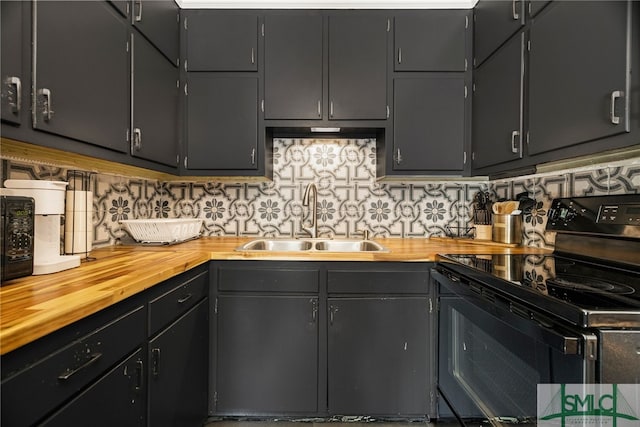 21 Berkley Pl, Savannah, GA 31405 - kitchen with black / electric stove, a sink, butcher block counters, and decorative backsplash