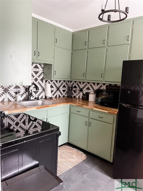 21 Berkley Pl, Savannah, GA 31405 - kitchen featuring black appliances, a sink, and butcher block counters