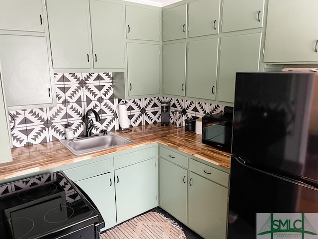 21 Berkley Pl, Savannah, GA 31405 - kitchen with black appliances, a sink, backsplash, and wooden counters