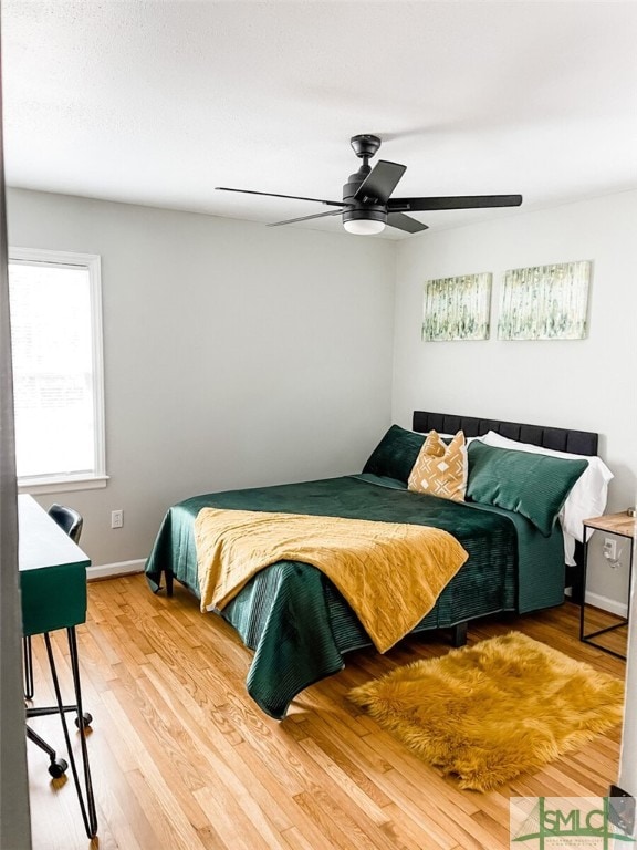 21 Berkley Pl, Savannah, GA 31405 - bedroom with wood finished floors, baseboards, and a ceiling fan