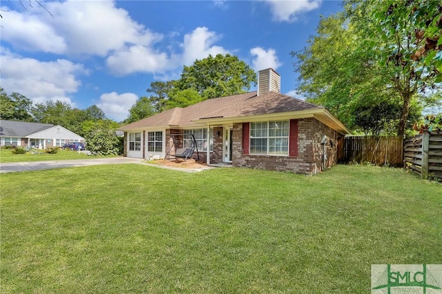 11 Pelican Ct, Richmond Hill, GA 31324 - rear view of house featuring a chimney and brick siding
