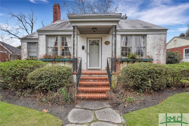 19 E 54th St, Savannah, GA 31405 - entrance to property with brick siding and a chimney