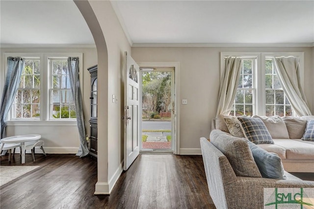 19 E 54th St, Savannah, GA 31405 - doorway featuring arched walkways, baseboards, crown molding, and dark wood finished floors