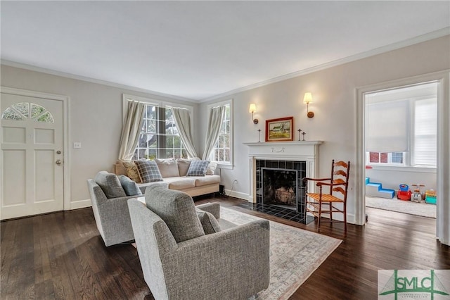 19 E 54th St, Savannah, GA 31405 - living room featuring ornamental molding, healthy amount of natural light, a tiled fireplace, dark wood-type flooring, and baseboards