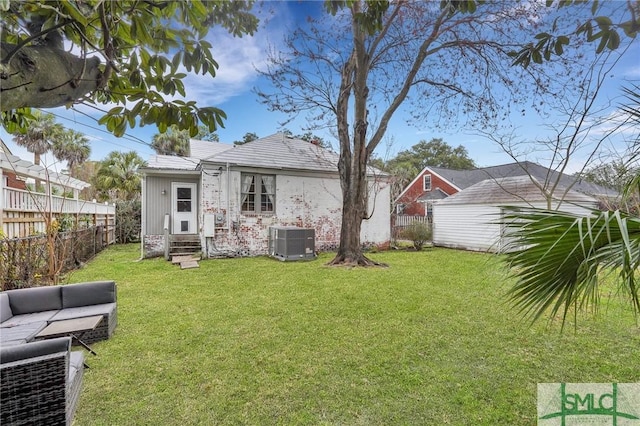 19 E 54th St, Savannah, GA 31405 - rear view of property with entry steps, central AC unit, an outdoor hangout area, brick siding, and an outdoor structure
