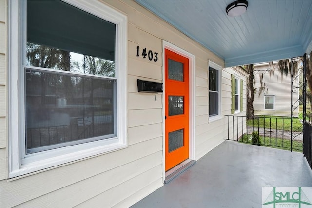 entrance to property featuring a porch
