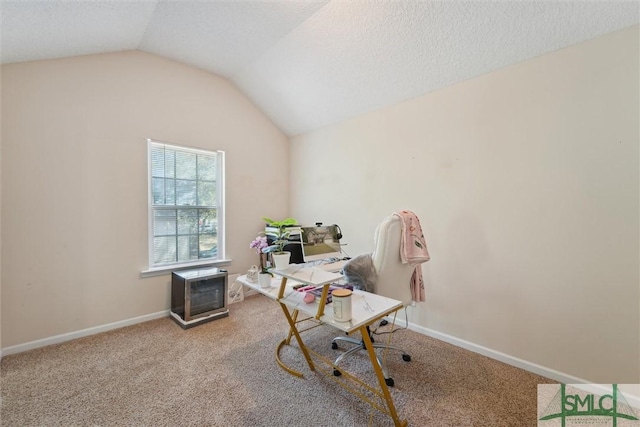 home office with carpet, lofted ceiling, and baseboards
