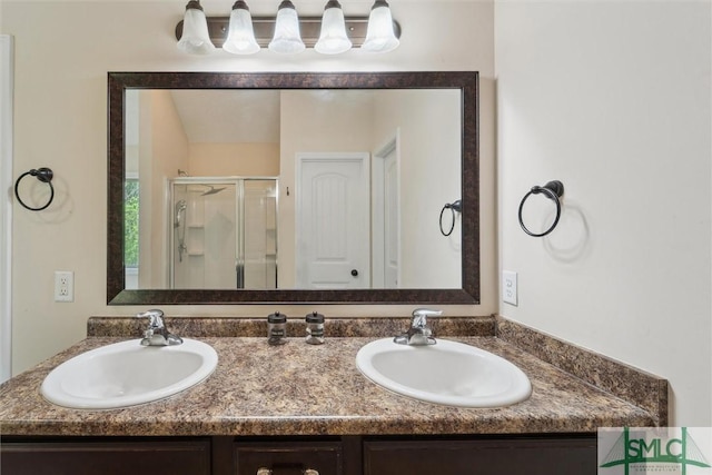 full bath with a shower stall and double vanity