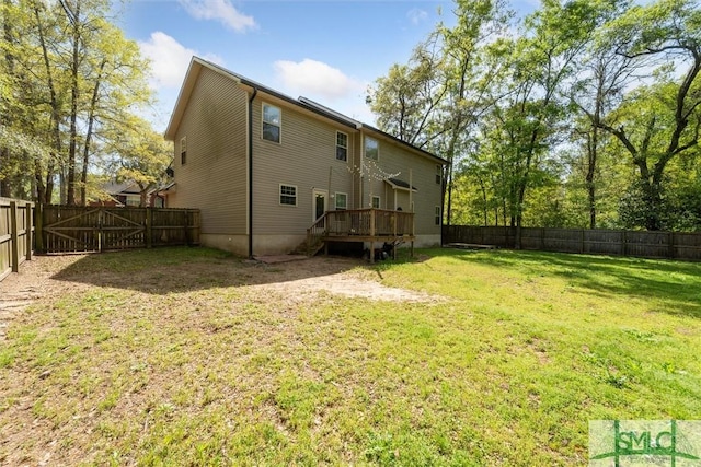 rear view of property with a wooden deck