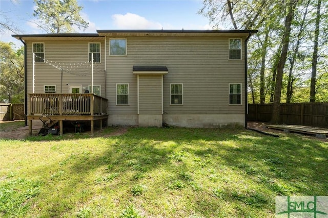 rear view of property with a wooden deck