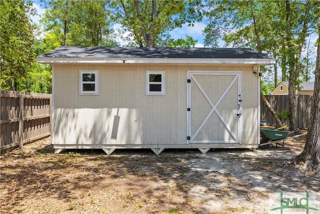 view of shed with a fenced backyard