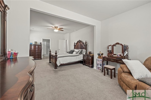 bedroom featuring light colored carpet and ceiling fan