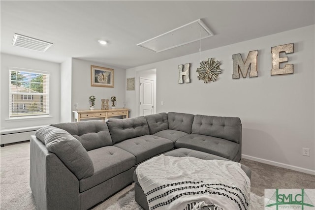 carpeted living area featuring attic access, a baseboard radiator, and baseboards