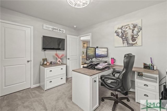 office area with light colored carpet and baseboards