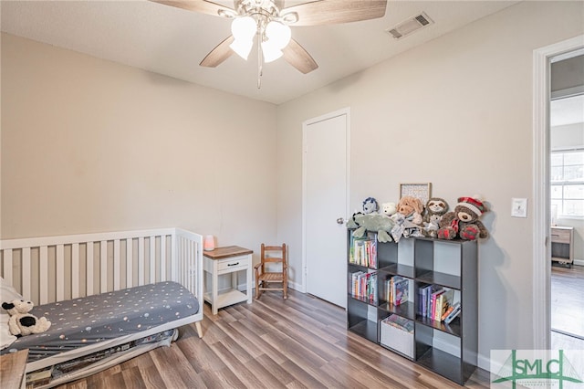 938 Greenbriar Trl, Hinesville, GA 31313 - bedroom with wood finished floors, baseboards, and a ceiling fan