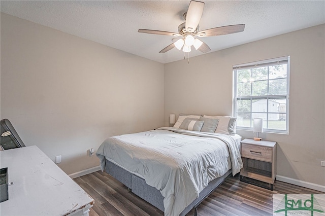 938 Greenbriar Trl, Hinesville, GA 31313 - bedroom with wood finished floors, baseboards, ceiling fan, and a textured ceiling