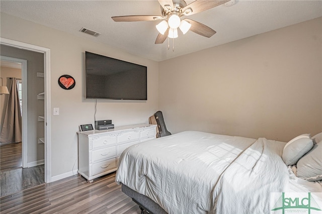938 Greenbriar Trl, Hinesville, GA 31313 - bedroom featuring wood finished floors, a ceiling fan, and baseboards