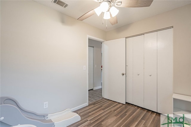 938 Greenbriar Trl, Hinesville, GA 31313 - unfurnished bedroom with wood finished floors, a closet, and ceiling fan