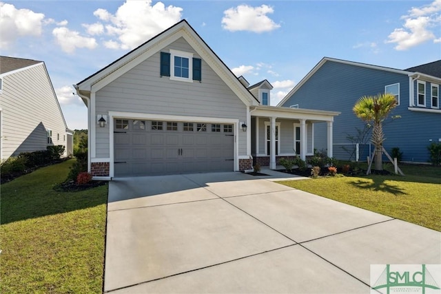 view of front of home featuring covered porch, a front yard, concrete driveway, and brick siding