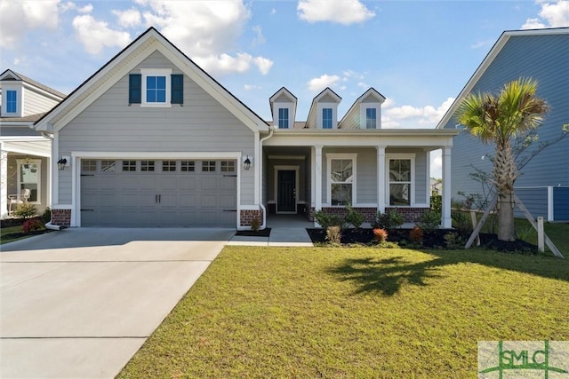 view of front of house featuring brick siding, driveway, a front yard, and an attached garage