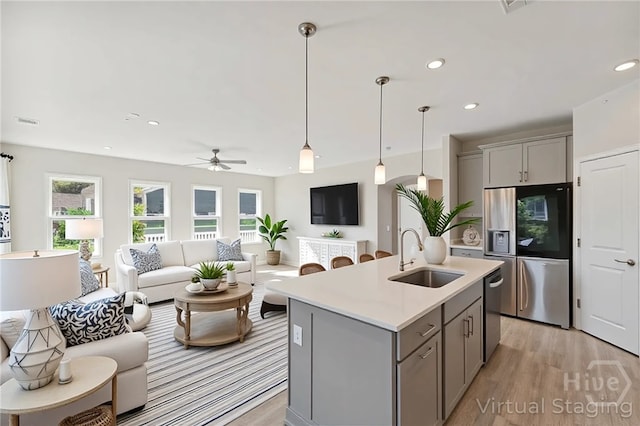 152 Harvest Hl, Pooler, GA 31322 - kitchen with a sink, gray cabinetry, appliances with stainless steel finishes, open floor plan, and recessed lighting