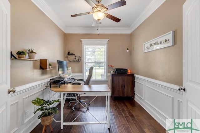 office area with a wainscoted wall, ornamental molding, ceiling fan, dark wood finished floors, and a decorative wall