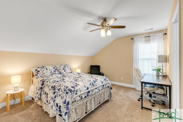 bedroom featuring carpet flooring, baseboards, lofted ceiling, and a desk