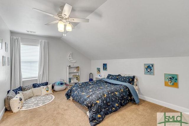 carpeted bedroom featuring a ceiling fan, vaulted ceiling, and baseboards