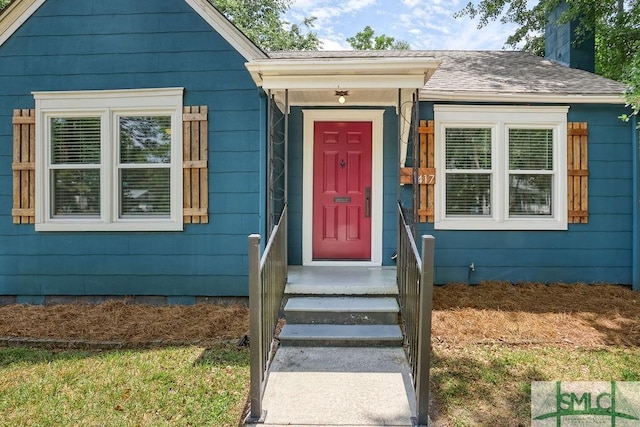 417 E 61st St, Savannah, GA 31405 - view of front of house with roof with shingles and a chimney