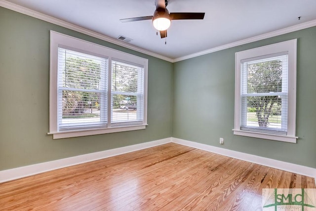417 E 61st St, Savannah, GA 31405 - empty room featuring healthy amount of natural light, light wood-style floors, baseboards, crown molding, and a ceiling fan