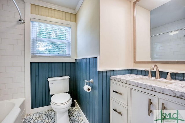 417 E 61st St, Savannah, GA 31405 - bathroom featuring toilet, vanity, a wainscoted wall, crown molding, and washtub / shower combination