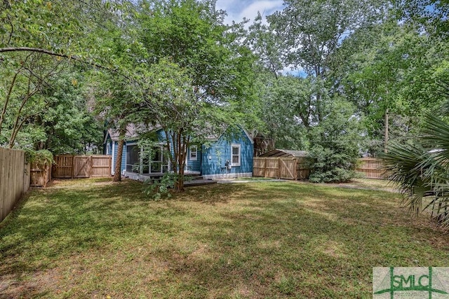 417 E 61st St, Savannah, GA 31405 - view of yard featuring a gate, a shed, and an outdoor structure