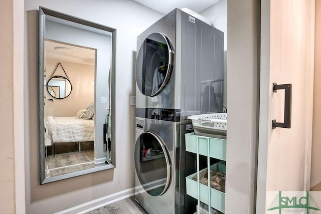 417 E 61st St, Savannah, GA 31405 - laundry room featuring estacked washer and dryer and baseboards