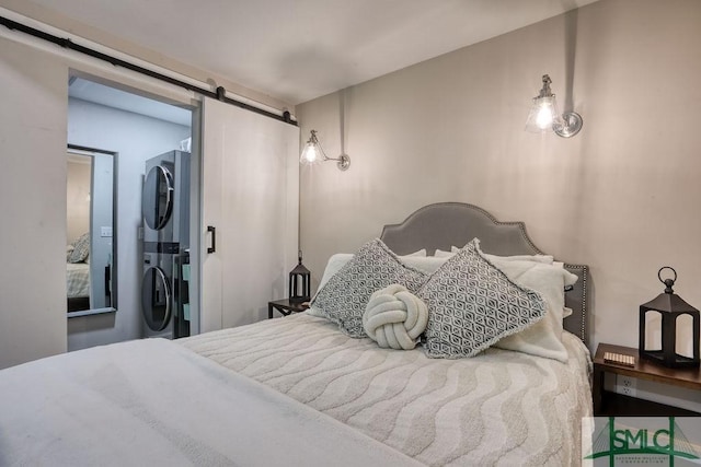 417 E 61st St, Savannah, GA 31405 - bedroom with estacked washer and dryer and a barn door