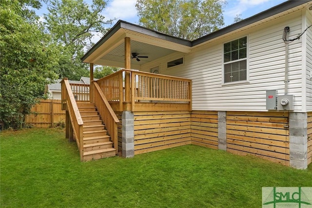 rear view of property with ceiling fan, stairs, and a deck