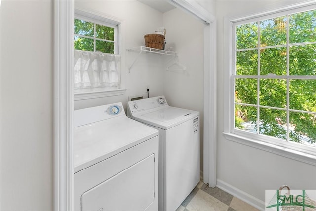 524 Nicoll St, Savannah, GA 31401 - laundry area featuring washer and clothes dryer, healthy amount of natural light, and baseboards