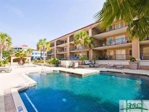 community pool featuring a patio