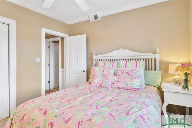 bedroom featuring crown molding and ceiling fan