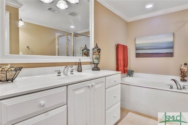 bathroom featuring ornamental molding, a stall shower, vanity, and a bath